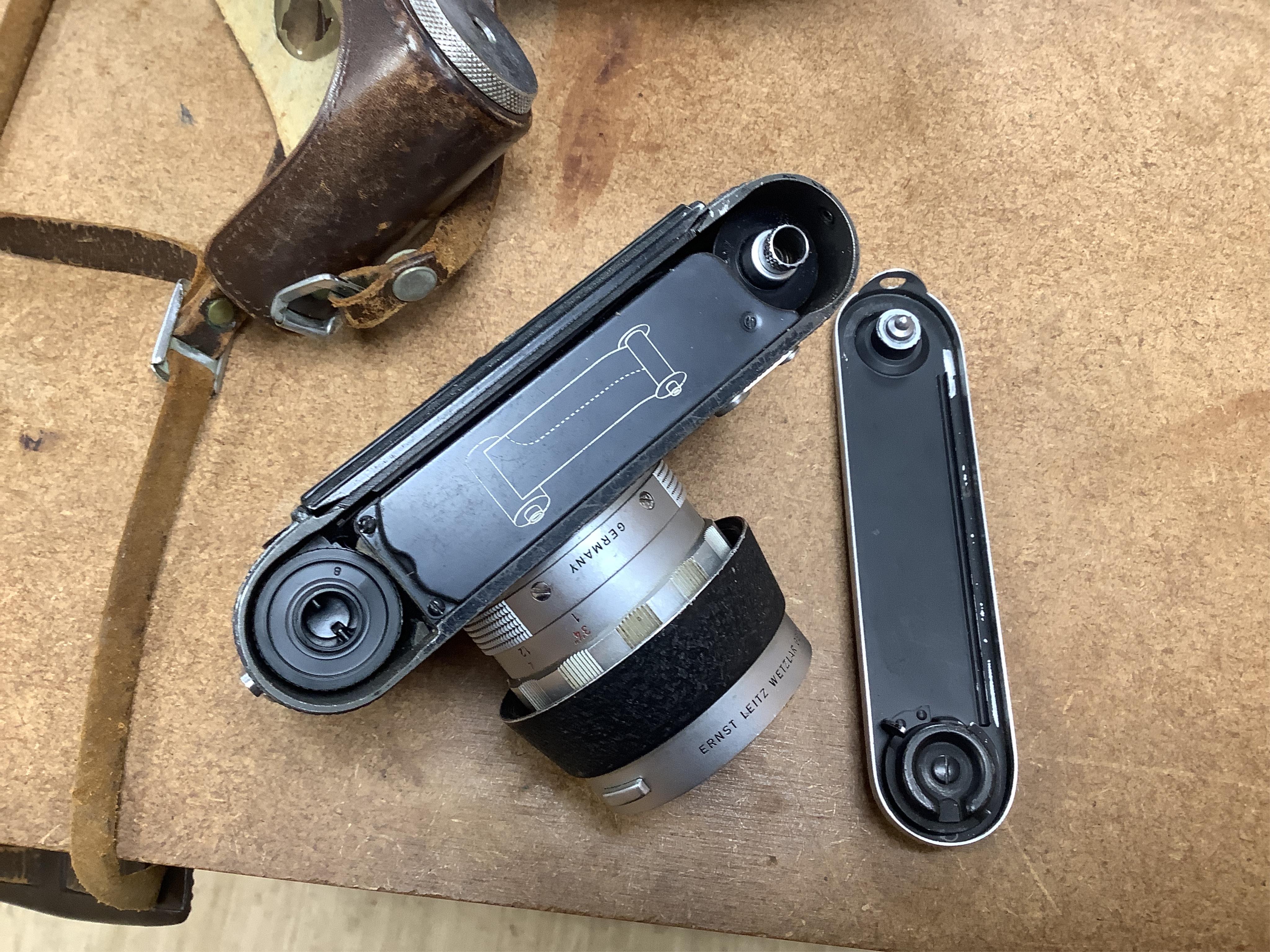 A Leica M2 camera, serial no. 982947, c. 1959, with Summilux 1:1. 4/50 lens, in leather case with strap